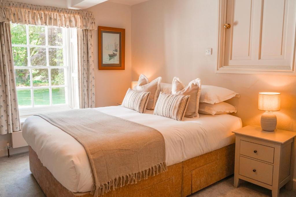 Bedroom with sash window looking onto the garden